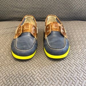Cole Haan slip on boat shoe.